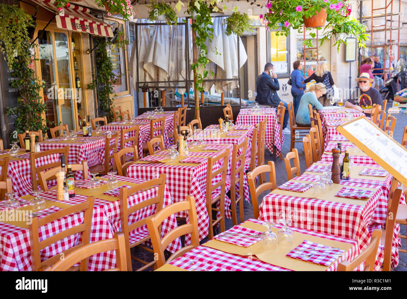 Traditional Italian Restaurant In Rome With Red And White Check